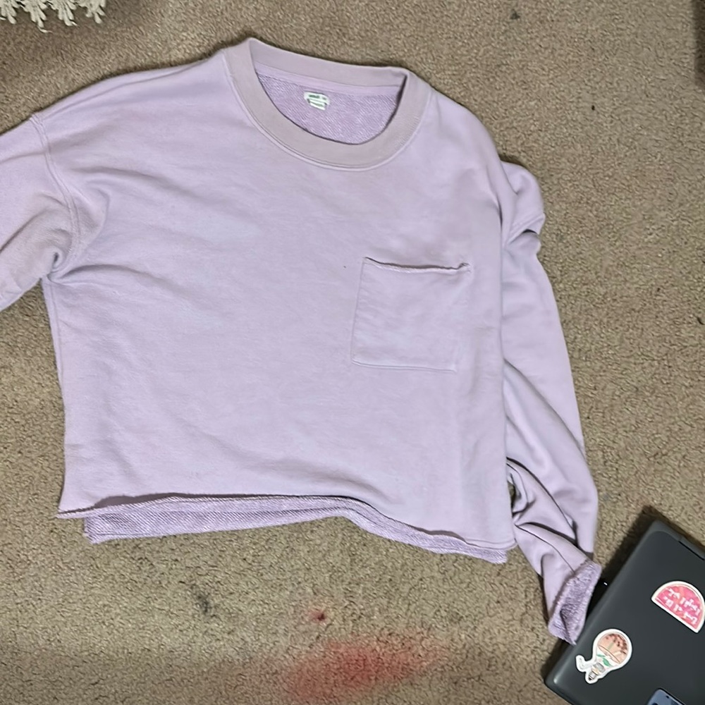 Pastel purple sweater size medium, the end of the sleeves have slits